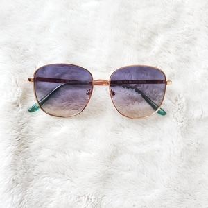 Aviator style gold colored sunglasses